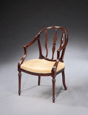 A GEORGE III MAHOGANY OPEN ARMCHAIR ATTRIBUTED TO JOHN LINNELL