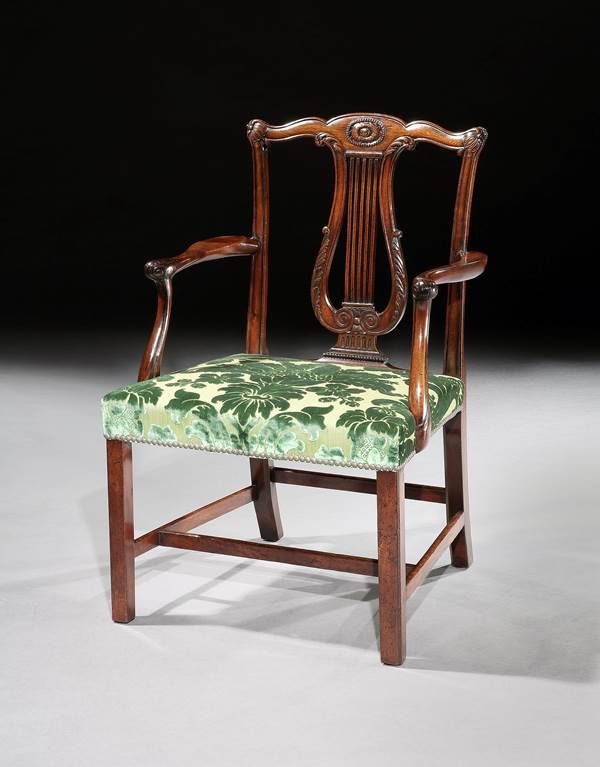 A SET OF TWELVE GEORGE III DINING CHAIRS ATTRIBUTED TO THOMAS CHIPPENDALE