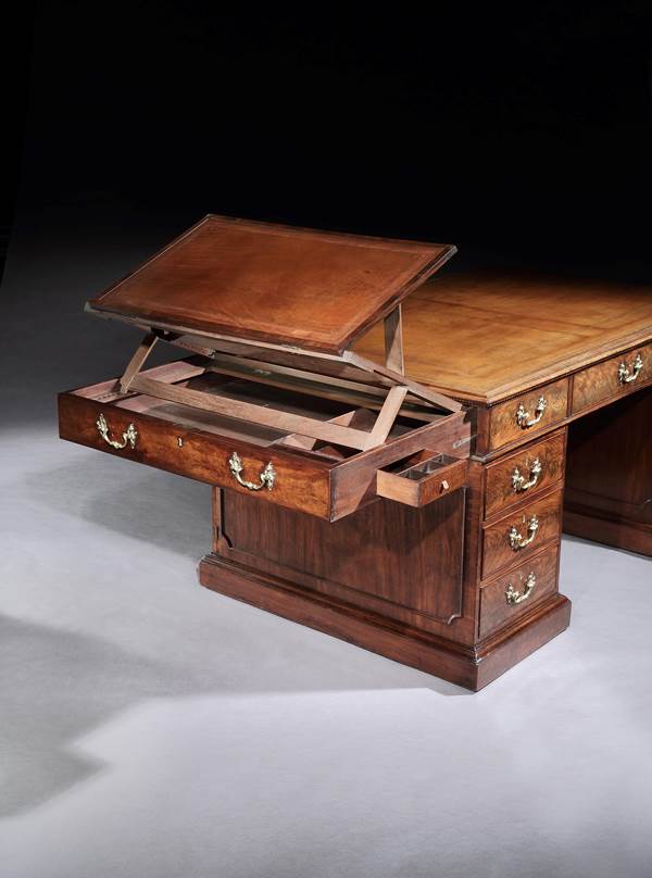 A GEORGE III MAHOGANY LIBRARY DESK BY THOMAS CHIPPENDALE