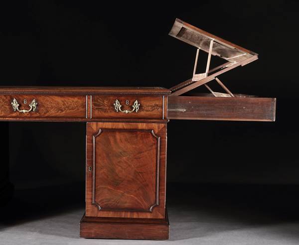 A GEORGE III MAHOGANY LIBRARY DESK BY THOMAS CHIPPENDALE