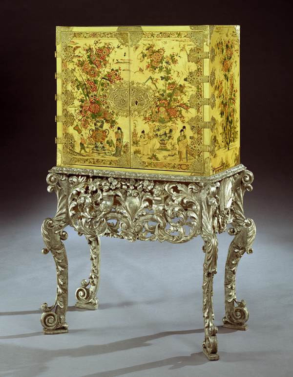 A CHARLES II CREAM JAPANNED CABINET ON SILVERED STAND 
