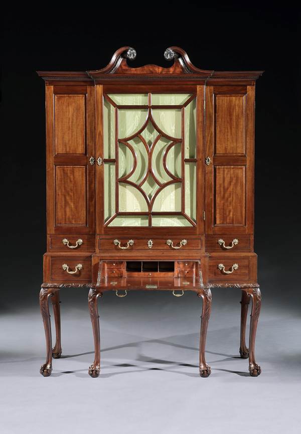 A GEORGE II MAHOGANY BREAKFRONT SECRÉTAIRE CABINET ON STAND 