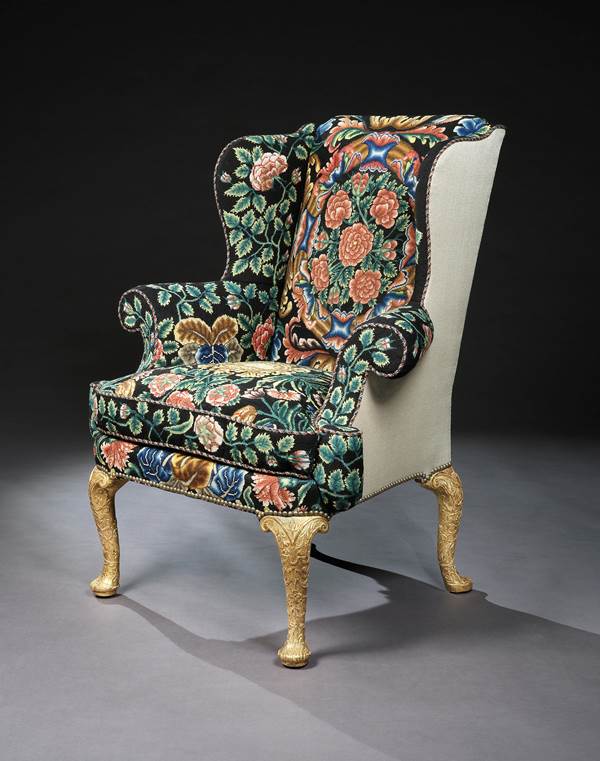 A GEORGE I GESSO AND NEEDLEWORK WING CHAIR