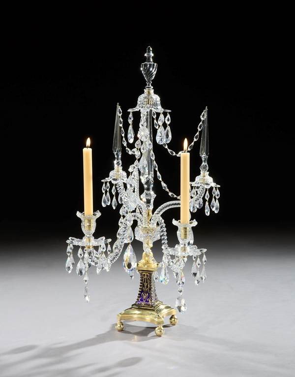 A PAIR OF GEORGE III ORMOLU MOUNTED CUT GLASS TWO LIGHT CANDELABRA BY WILLIAM PARKER & SON