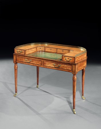 A GEORGE III SATINWOOD CARLTON HOUSE WRITING TABLE ATTRIBUTED TO GILLOWS