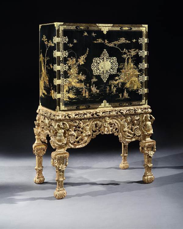 A CHARLES II BLACK JAPANNED CABINET ON GILTWOOD STAND