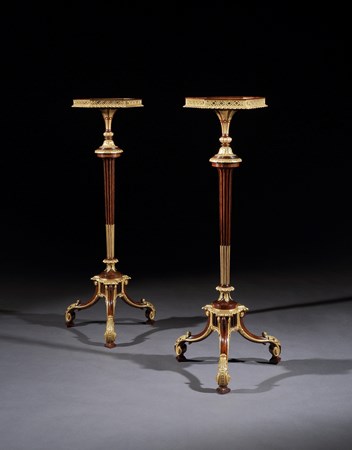A PAIR OF GEORGE III ROSEWOOD TORCHÈRES ATTRIBUTED TO THOMAS CHIPPENDALE