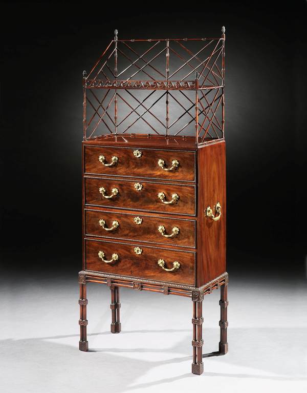 A GEORGE III MAHOGANY SECRÉTAIRE CABINET ON STAND ATTRIBUTED TO WILLIAM VILE