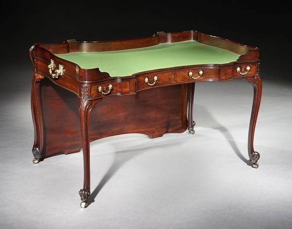 A GEORGE III MAHOGANY WRITING TABLE ALMOST CERTAINLY BY WILLIAM VILE