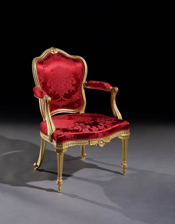 A PAIR OF GEORGE III GILTWOOD ARMCHAIRS ALMOST CERTAINLY BY THOMAS CHIPPENDALE