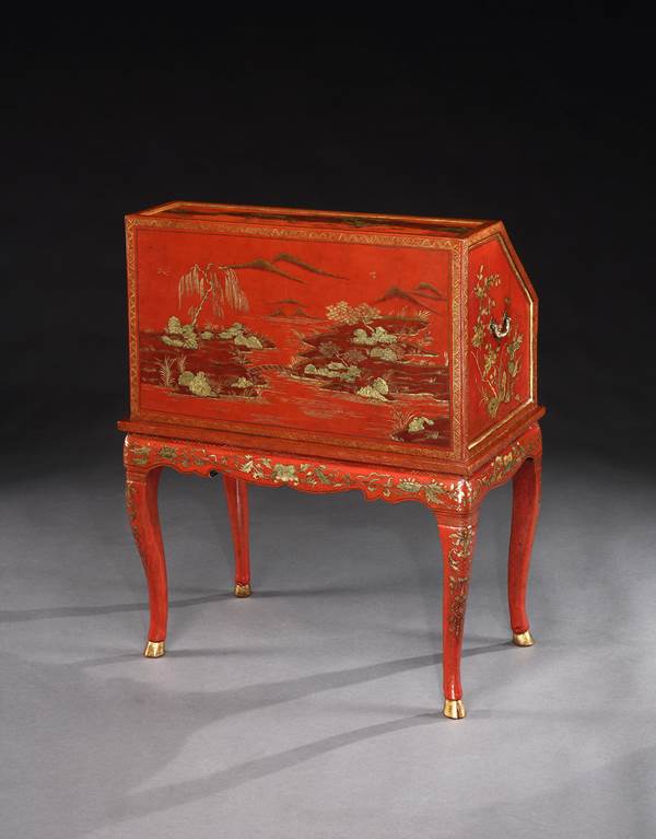 A GEORGE II PERIOD CHINESE RED LACQUER BUREAU ON STAND