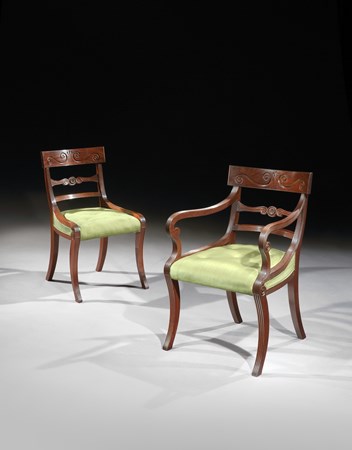 A SET OF EIGHTEEN DINING CHAIRS