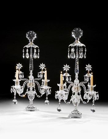 A PAIR OF GEORGE III CUT GLASS TWO LIGHT CANDELABRA ATTRIBUTED TO WILLIAM PARKER
