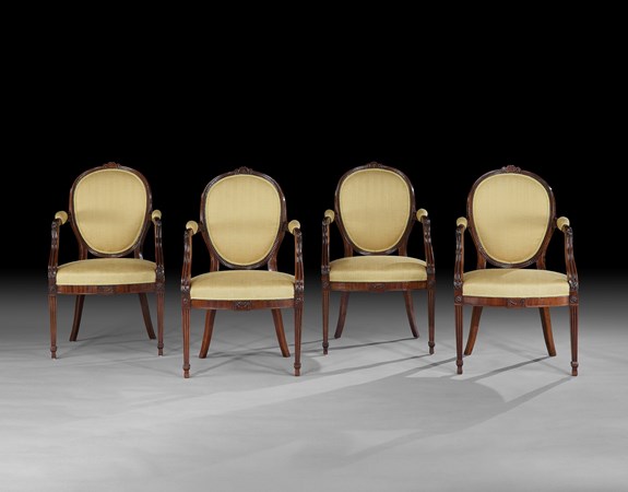 A SET OF FOUR GEORGE III MAHOGANY ARMCHAIRS ATTRIBUTED TO GILLOWS
