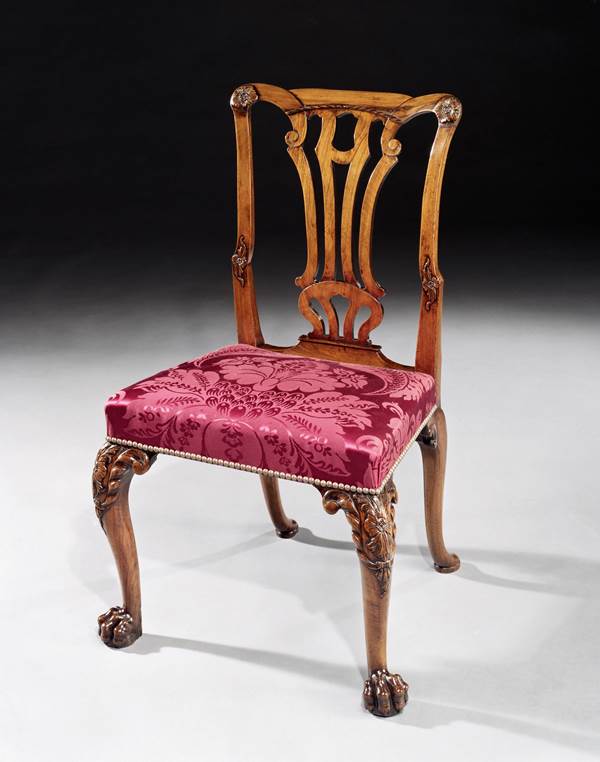 A SET OF SIXTEEN GEORGE II WALNUT DINING CHAIRS INCLUDING FIVE SIDE CHAIRS OF LATER DATE