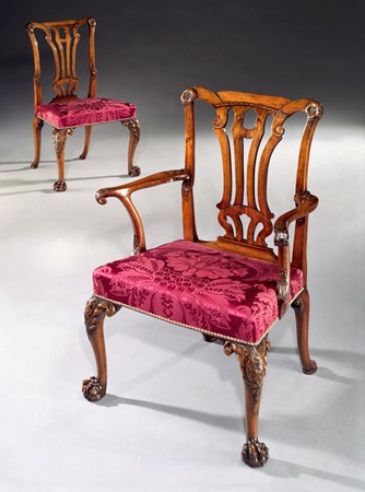 A SET OF SIXTEEN GEORGE II WALNUT DINING CHAIRS INCLUDING FIVE SIDE CHAIRS OF LATER DATE