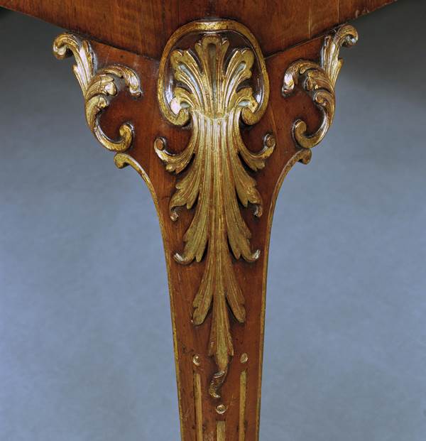 A GEORGE II WALNUT AND PARCEL GILT CARD TABLE ATTRIBUTED TO PAUL SAUNDERS