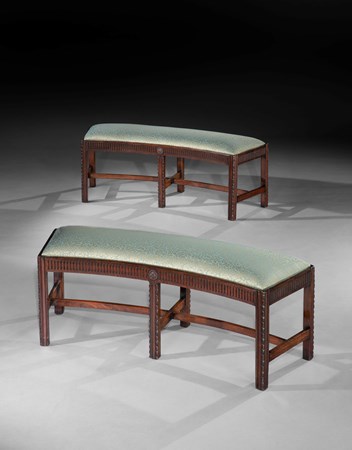 A PAIR OF GEORGE III MAHOGANY CURVED STOOLS OR WINDOW SEATS