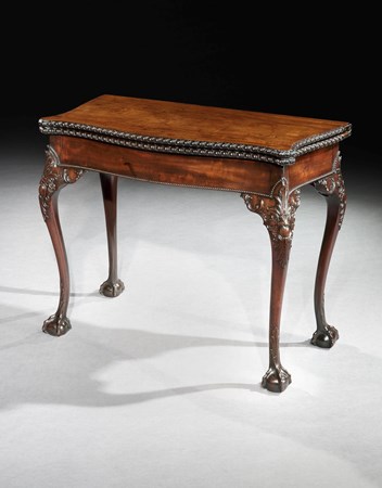 A GEORGE II MAHOGANY CARD TABLE WITH NEEDLEWORK PLAYING SURFACE
