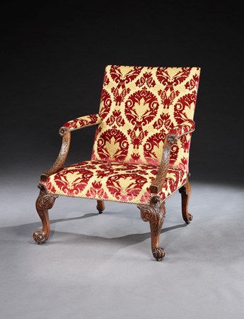 A GEORGE II WALNUT LIBRARY ARMCHAIR ATTRIBUTED TO GILES GRENDEY
