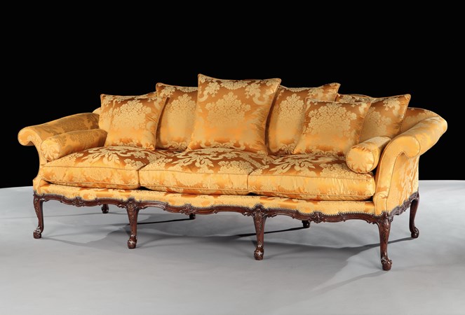 A GEORGE II MAHOGANY SETTEE ATTRIBUTED TO WRIGHT AND ELWICK
