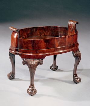 A GEORGE II MAHOGANY WINE COOLER ON STAND