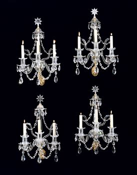 A SET OF FOUR GEORGE III ORMOLU MOUNTED CUT GLASS WALL LIGHTS ATTRIBUTED TO WILLIAM PARKER