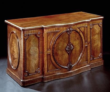 A HIGHLY IMPORTANT SERPENTINE COMMODE ATTRIBUTED TO JOHN BRADBURN