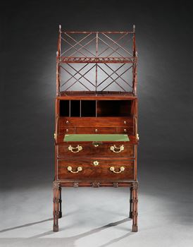 A GEORGE III MAHOGANY SECRÉTAIRE CABINET ON STAND ATTRIBUTED TO WILLIAM VILE
