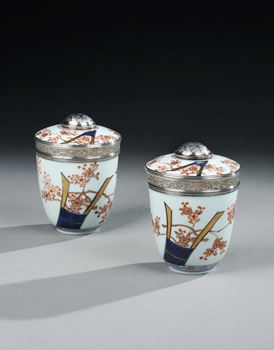 A PAIR OF JAPANESE SILVER MOUNTED IMARI PORCELAIN POTS AND COVERS