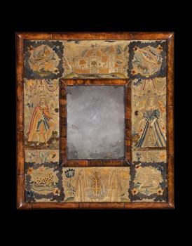 A CHARLES II STUMPWORK MIRROR IN A COCUS WOOD AND WALNUT FRAME