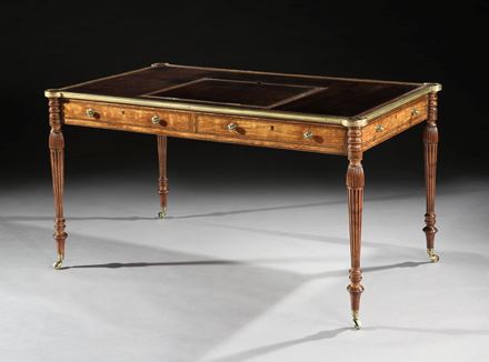 A GEORGE III SATINWOOD BRASS MOUNTED WRITING TABLE