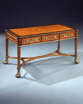 A REGENCY SATINWOOD BOULLE INLAID AND FAUX BAMBOO LIBRARY TABLE
