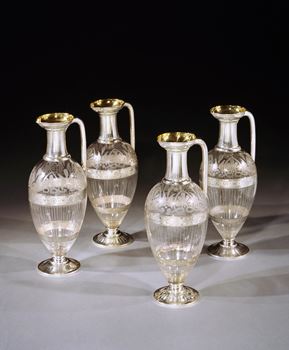 A SET OF FOUR VICTORIAN SILVER MOUNTED ETCHED GLASS CLARET JUGS BY EDWARD JOHN AND WILLIAM BARNARD