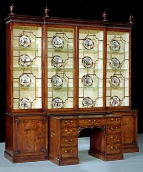 A GEORGE III BREAKFRONT BOOKCASE ATTRIBUTED TO THOMAS CHIPPENDALE