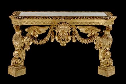 A MAGNIFICENT GEORGE II CARVED GILTWOOD SIDE TABLE IN THE MANNER OF WILLIAM KENT