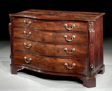 AN IMPORTANT MAHOGANY SERPENTINE COMMODE