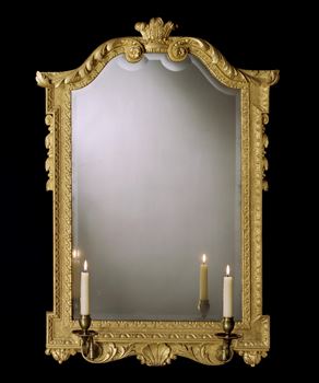A RARE GEORGE II CARVED GILTWOOD MIRROR