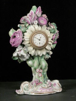Sunflower and posy shaped clock case.
